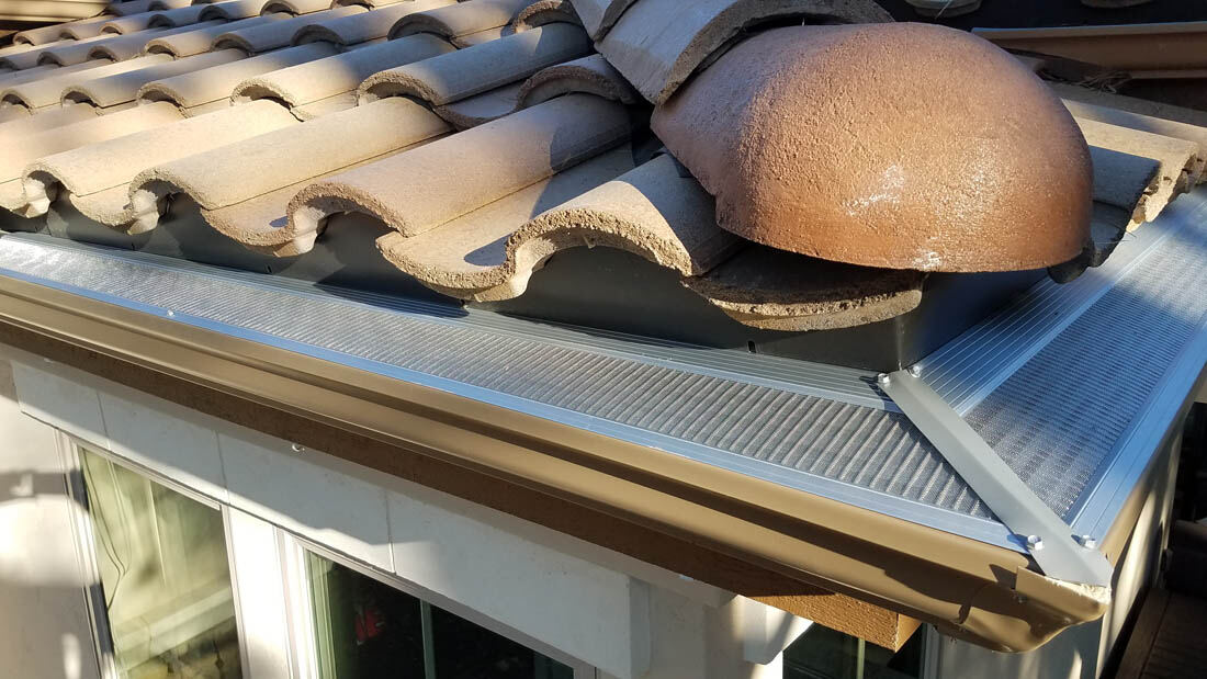 Gutter guard fitted cleanly around a roof corner
