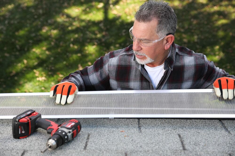 Gutter guard installation in progress on a Kirkland home